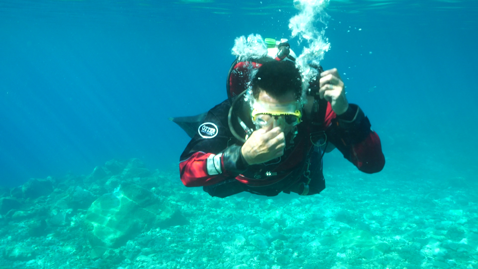 Scuba diver equalizing