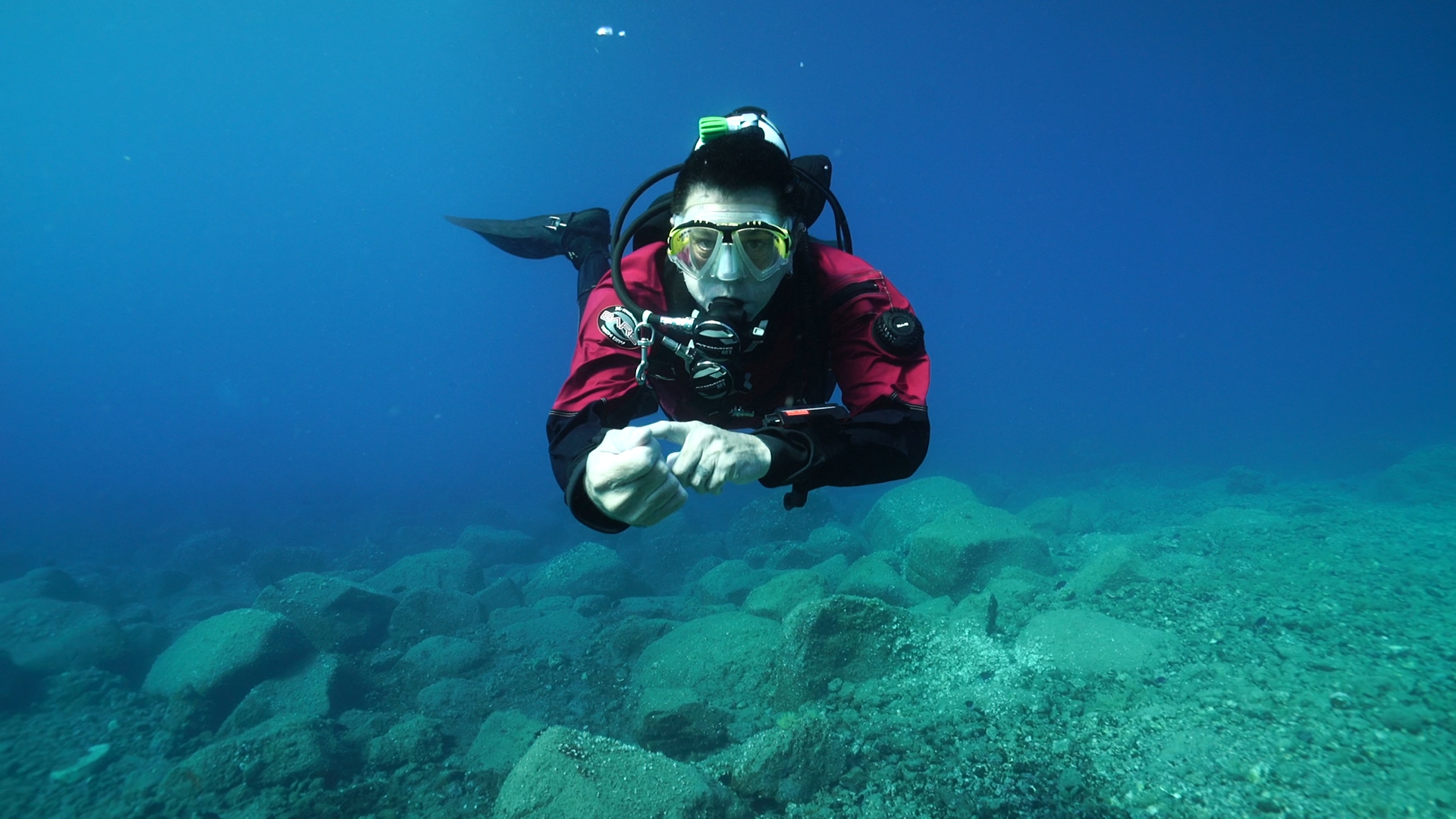 Scuba diver checking the gauge