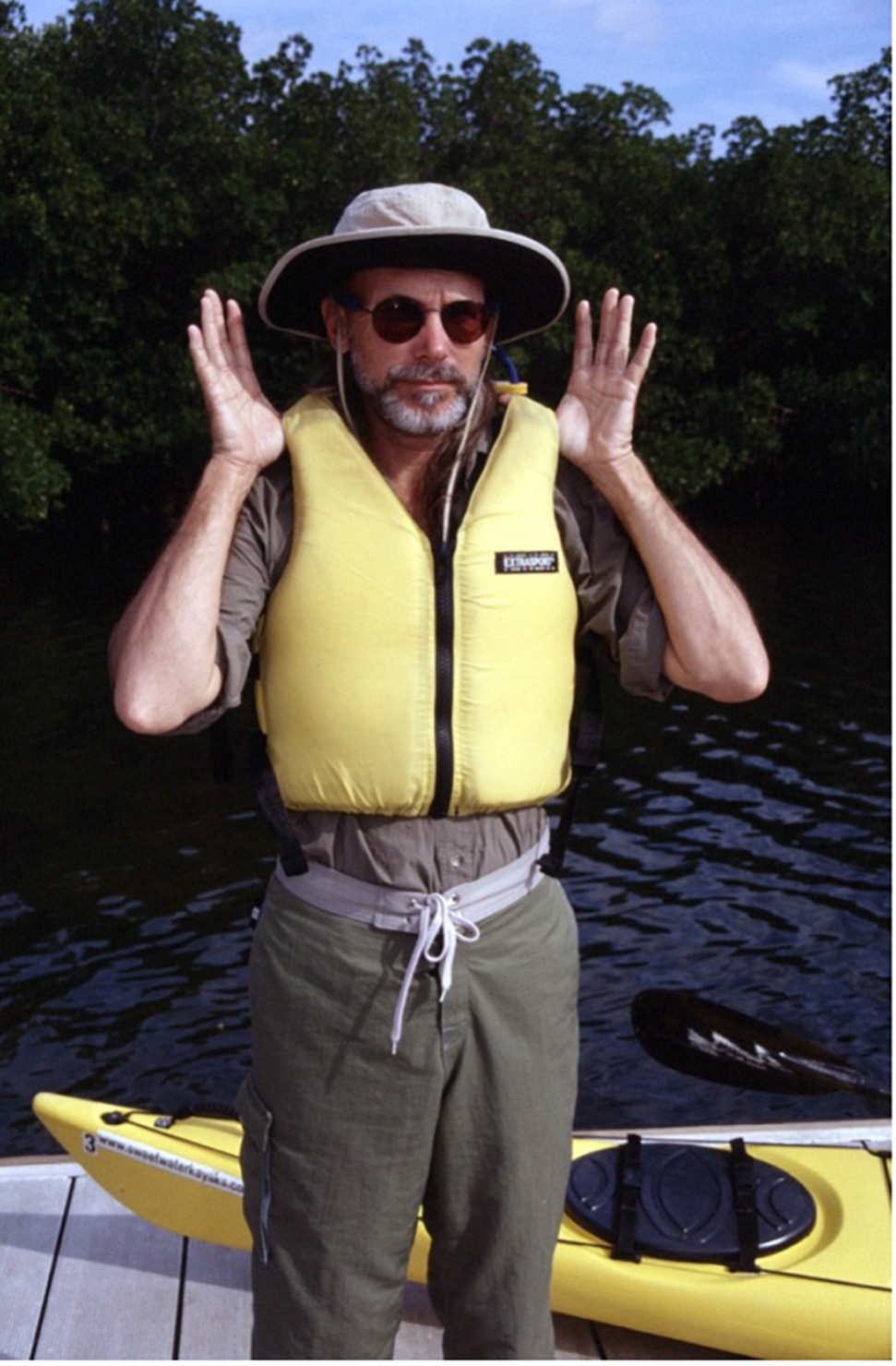 man testing life jacket for proper fit